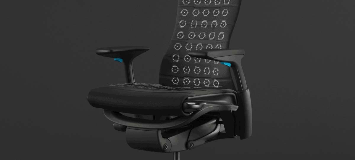 Una animación resaltando la distribución uniforme de la presión de la silla para videojuegos Embody superpuesta en una foto de la silla con un fondo negro.
